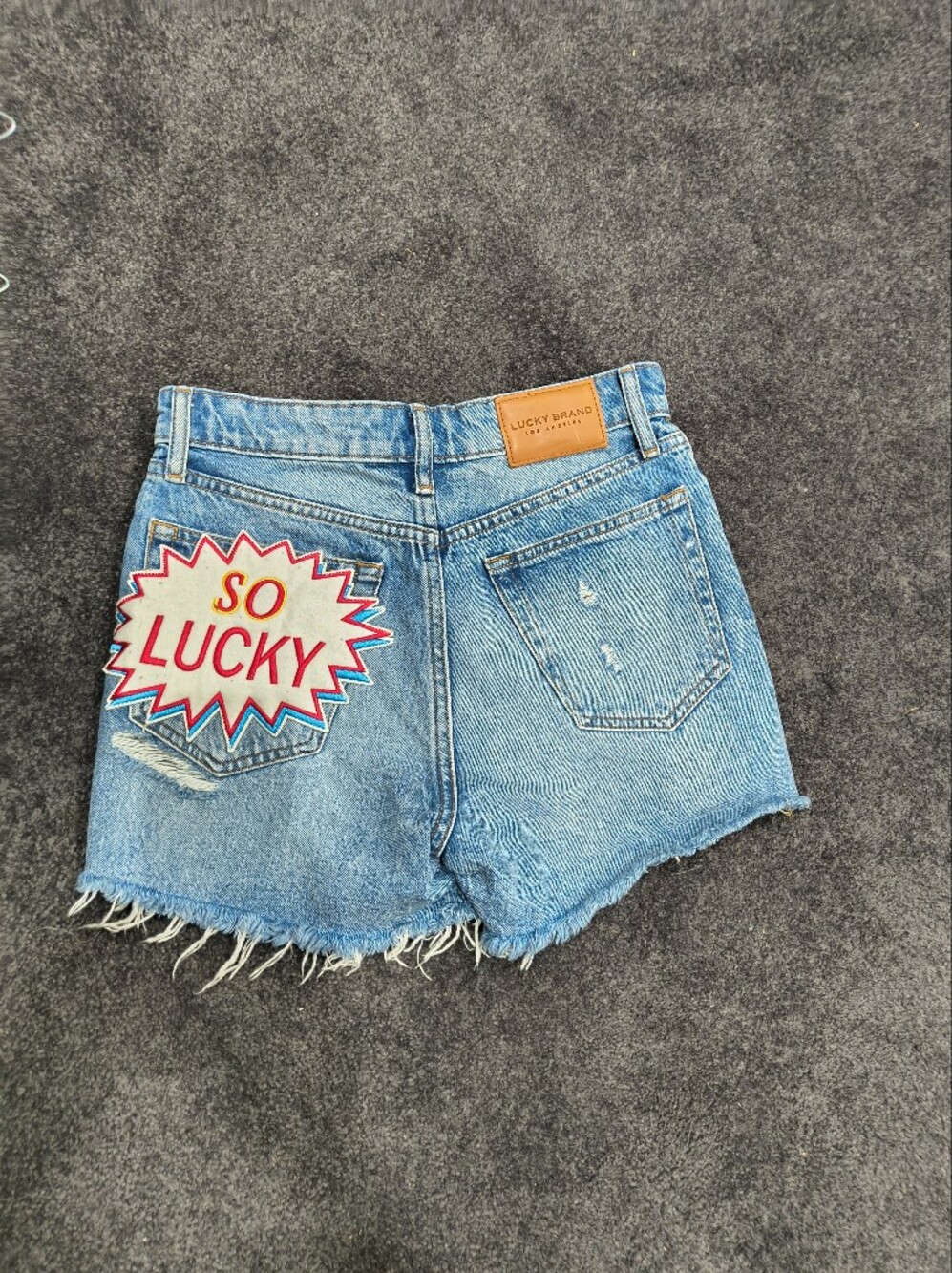Lucky Brand Light Blue Denim Shorts with 'So Lucky' Patch
